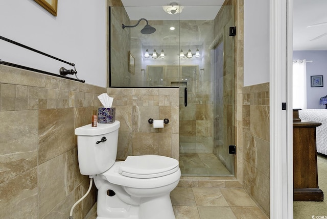 153 Garden Ave, Georgetown, SC 29440 - bathroom with tile walls, toilet, and a stall shower