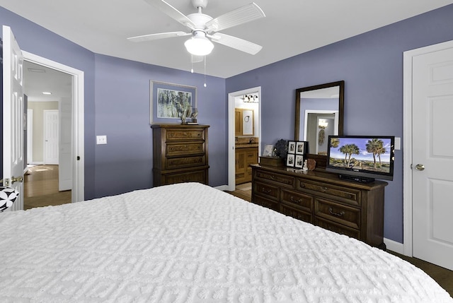 153 Garden Ave, Georgetown, SC 29440 - bedroom with baseboards, connected bathroom, and ceiling fan