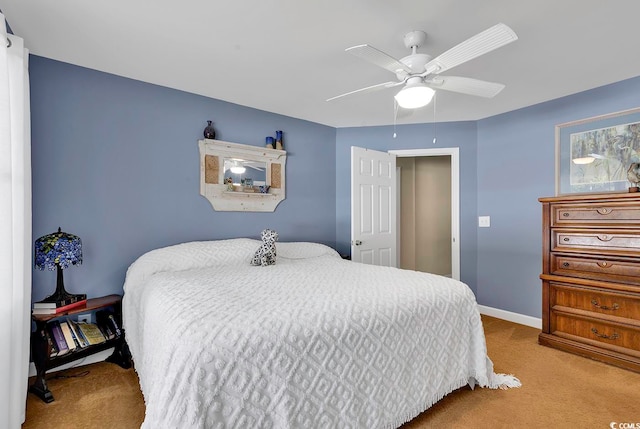 bedroom featuring light colored carpet and ceiling fan