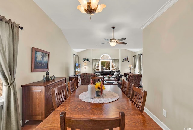 dining space featuring ceiling fan, dark hardwood / wood-style floors, and ornamental molding