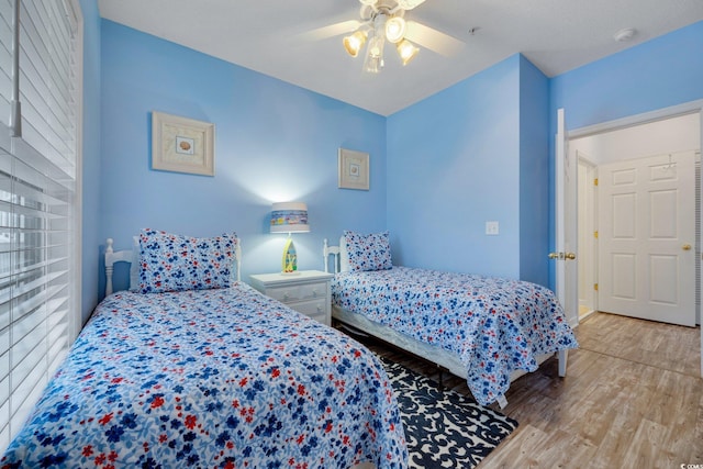 bedroom featuring light hardwood / wood-style flooring and ceiling fan