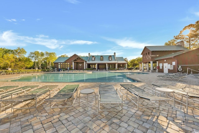 view of swimming pool featuring a patio