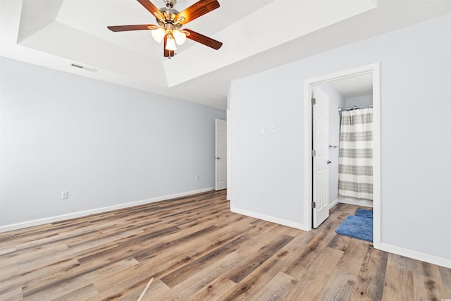 481 Irees Way, Longs, SC 29568 - spare room with light wood finished floors, a ceiling fan, baseboards, and a raised ceiling