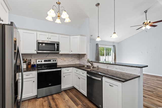 481 Irees Way, Longs, SC 29568 - kitchen featuring stainless steel appliances, a sink, a peninsula, decorative backsplash, and a chandelier