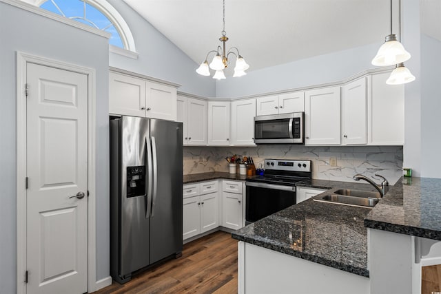 481 Irees Way, Longs, SC 29568 - kitchen with stainless steel appliances, a sink, a peninsula, decorative backsplash, and high vaulted ceiling