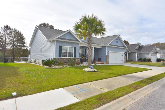 view of front facade featuring a garage and a front lawn