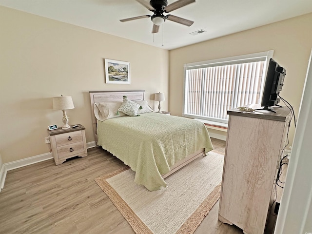 bedroom featuring hardwood / wood-style floors and ceiling fan