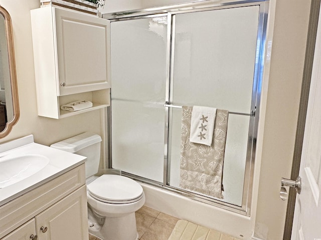 110 S Shore Blvd Unit 103, Longs, SC 29568 - bathroom with a shower with shower door, vanity, toilet, and tile patterned floors