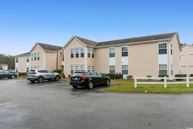 8546 Hopkins Cir Unit G, Surfside Beach, SC 29575 - view of property with uncovered parking and fence