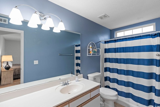 8546 Hopkins Cir Unit G, Surfside Beach, SC 29575 - bathroom featuring toilet, vanity, a textured ceiling, and a shower with shower curtain