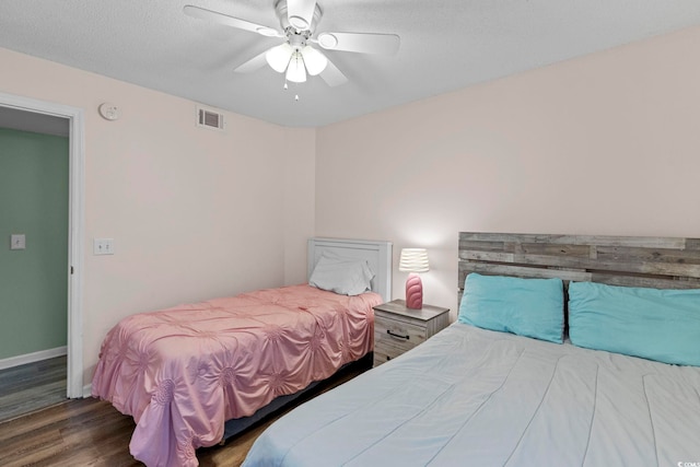 8546 Hopkins Cir Unit G, Surfside Beach, SC 29575 - bedroom with wood finished floors, baseboards, and a ceiling fan