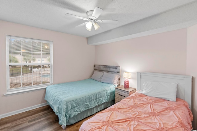 8546 Hopkins Cir Unit G, Surfside Beach, SC 29575 - bedroom with wood finished floors, baseboards, and a ceiling fan