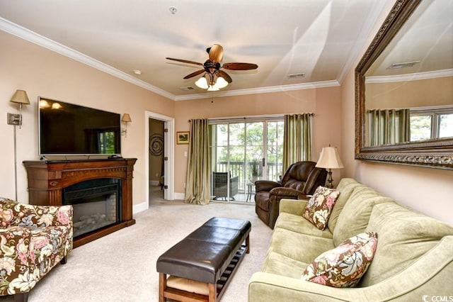 living room featuring carpet flooring, ceiling fan, and crown molding