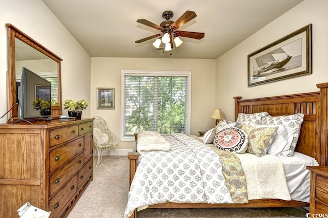 bedroom with light carpet and ceiling fan