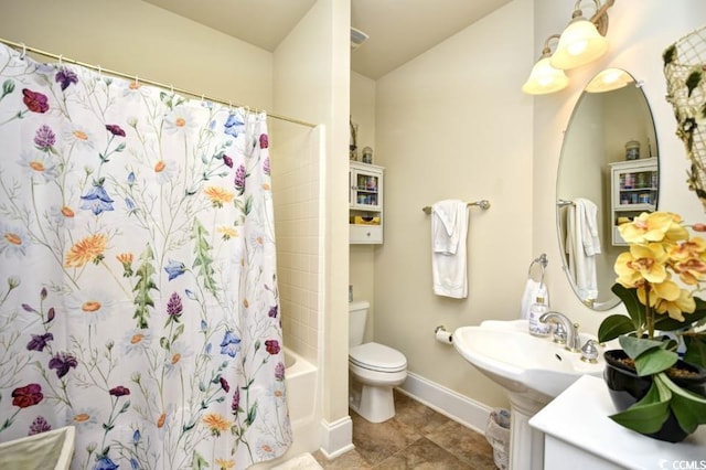 bathroom with tile patterned floors, toilet, and shower / tub combo with curtain