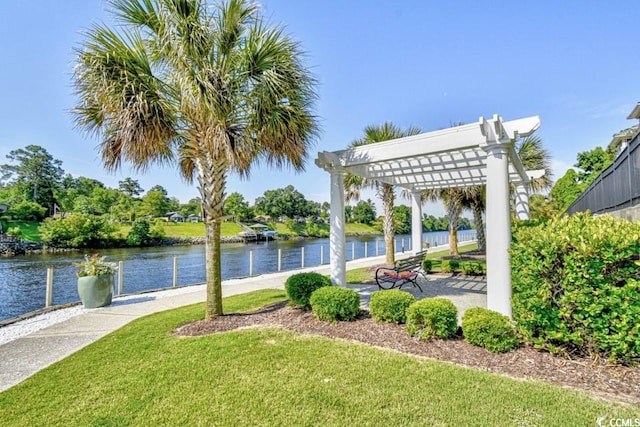 exterior space featuring a water view and a pergola