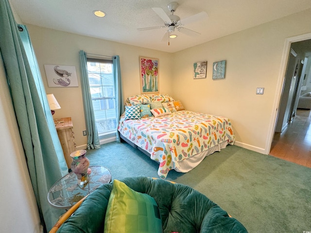 bedroom featuring ceiling fan and dark hardwood / wood-style floors