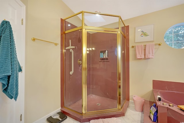 bathroom featuring tile patterned floors and a shower with shower door