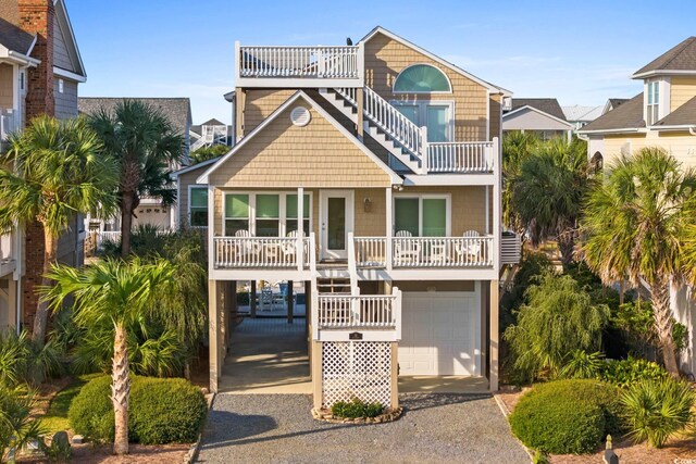 raised beach house with a garage