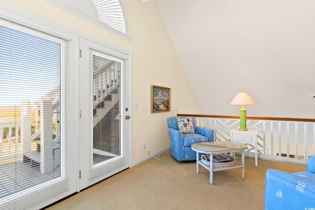 sitting room with carpet and lofted ceiling