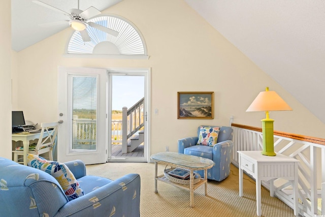 carpeted living room featuring high vaulted ceiling and ceiling fan