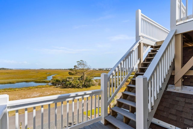 wooden terrace with a water view
