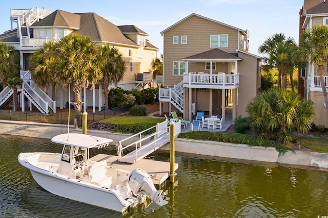 back of house featuring a patio and a water view