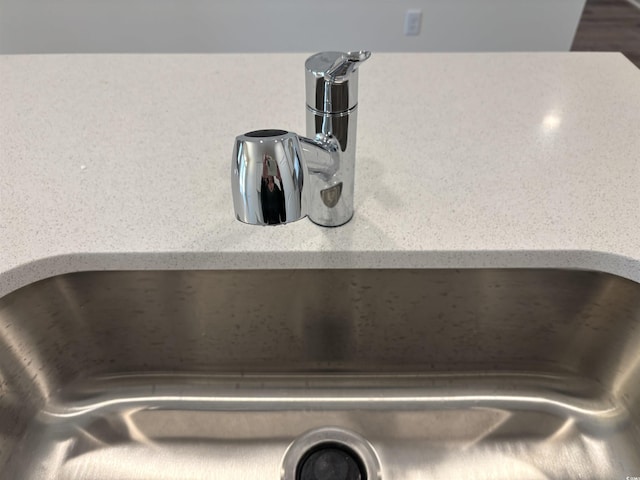 interior details with backsplash and sink