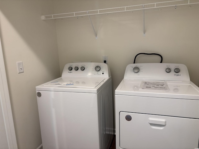 washroom with washing machine and dryer