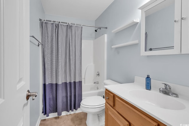 full bathroom featuring vanity, tile patterned floors, toilet, and shower / tub combo