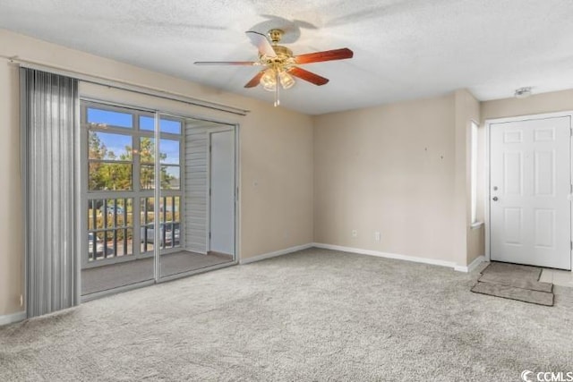 interior space featuring ceiling fan and a textured ceiling