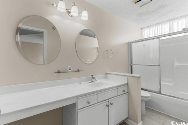 full bathroom with tile patterned flooring, enclosed tub / shower combo, a textured ceiling, vanity, and toilet