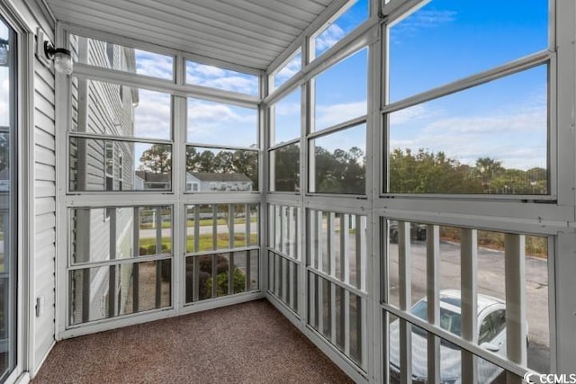 unfurnished sunroom featuring a wealth of natural light