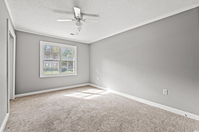 empty room with carpet, a textured ceiling, and ceiling fan