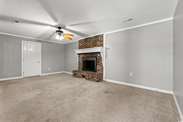 unfurnished living room featuring a textured ceiling, carpet floors, a brick fireplace, and ceiling fan