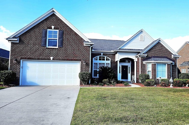 front of property featuring a garage and a front lawn