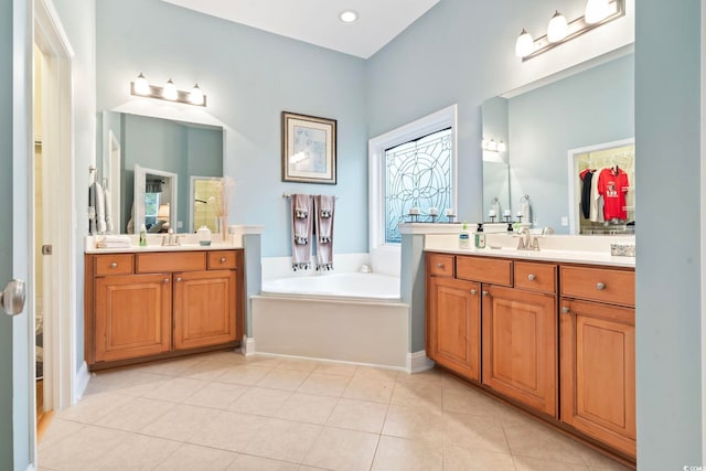 bathroom with vanity, tile patterned floors, and a bathing tub