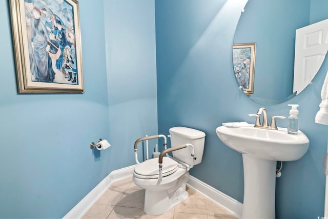 bathroom featuring toilet and tile patterned flooring