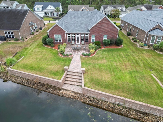 drone / aerial view with a water view