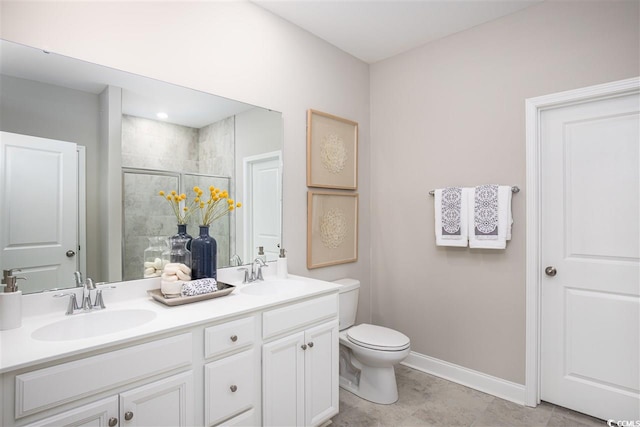 bathroom featuring vanity, tile patterned flooring, toilet, and walk in shower