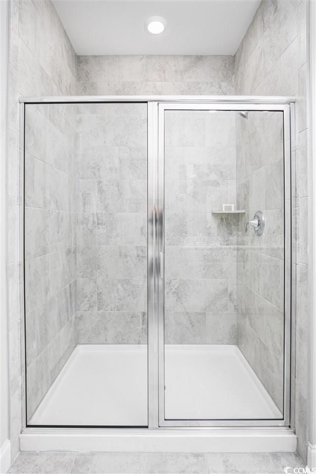 bathroom with a shower stall