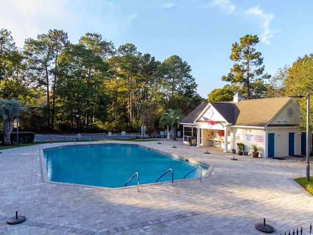 view of swimming pool featuring a patio area