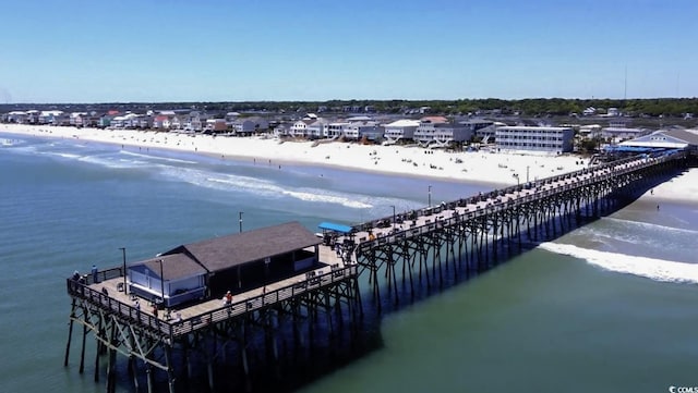 exterior space with a water view and a view of the beach