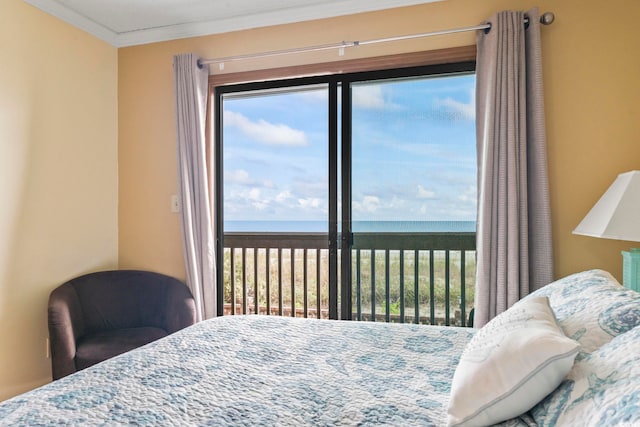 bedroom featuring a water view and crown molding