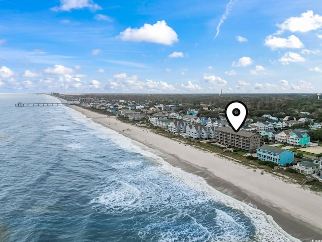 aerial view with a view of the beach and a water view