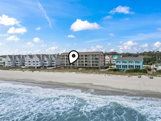 aerial view featuring a water view and a view of the beach