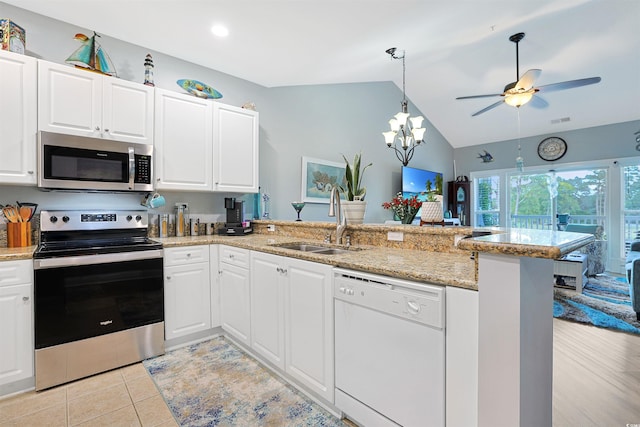 kitchen featuring white cabinets, kitchen peninsula, appliances with stainless steel finishes, and sink