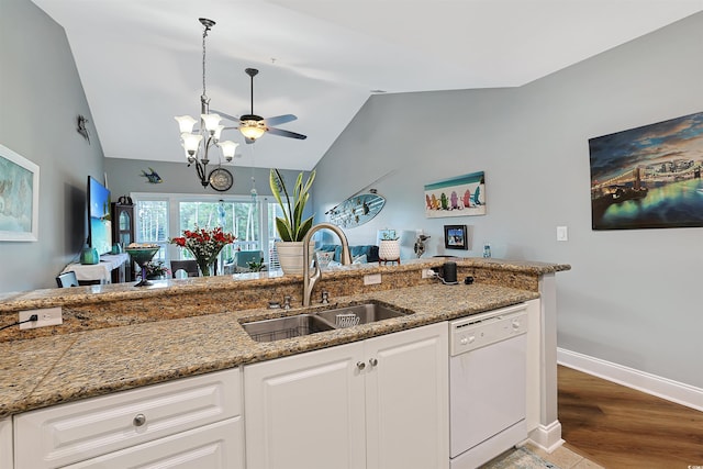 kitchen featuring dishwasher, white cabinetry, lofted ceiling, and sink