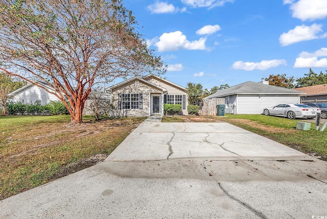 ranch-style home featuring a front yard