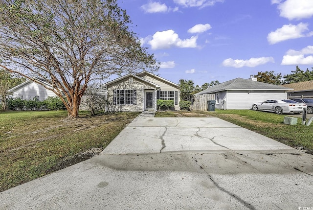 ranch-style home featuring a front yard